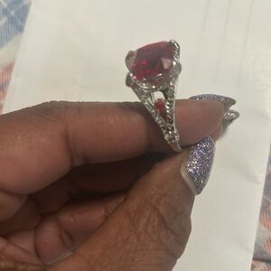 It’s a ruby red beautiful diamond cut ring.